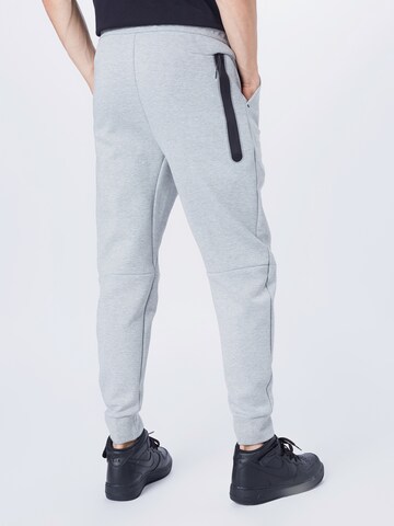 Nike Sportswear Дънки Tapered Leg Панталон в сиво