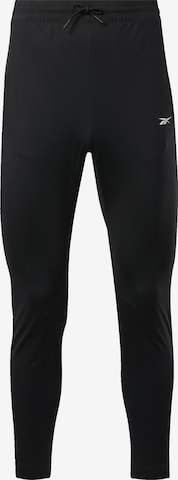 Effilé Pantalon de sport Reebok en noir : devant