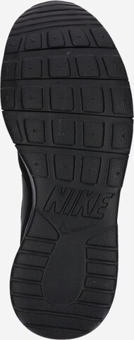 Baskets 'Tanjun' Nike Sportswear en noir : en bas