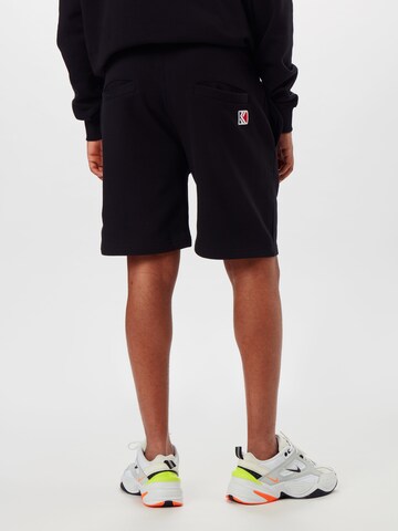 Karl Kani Regular Trousers in Black