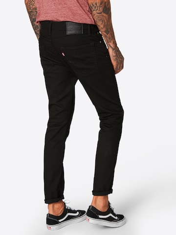 LEVI'S ® Tapered Jeans '513  Slim Taper' i svart