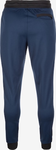 UNDER ARMOUR - Tapered Pantalón deportivo en azul