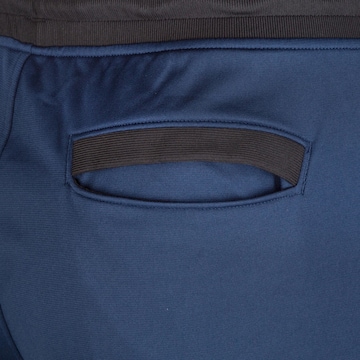 UNDER ARMOUR Tapered Sportbroek in Blauw