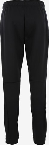 Coupe slim Pantalon de sport 'THRMA' NIKE en noir : derrière