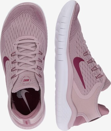 Chaussure de course 'Free RN' NIKE en rose : sur le côté