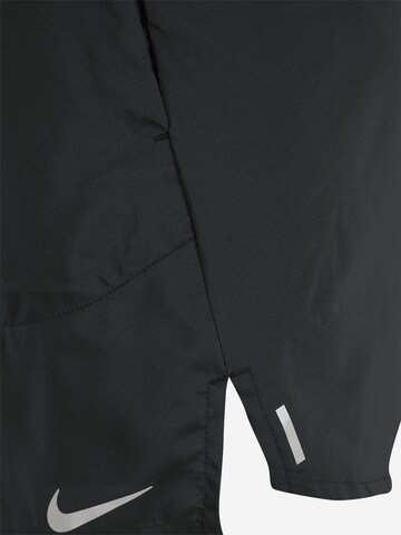 regular Pantaloni sportivi 'Flex Stride' di NIKE in nero