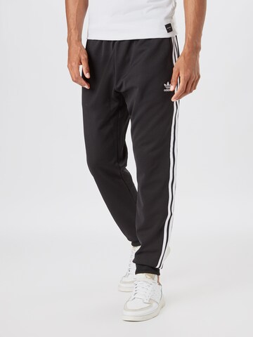 ADIDAS ORIGINALS Tapered Trousers in Black: front