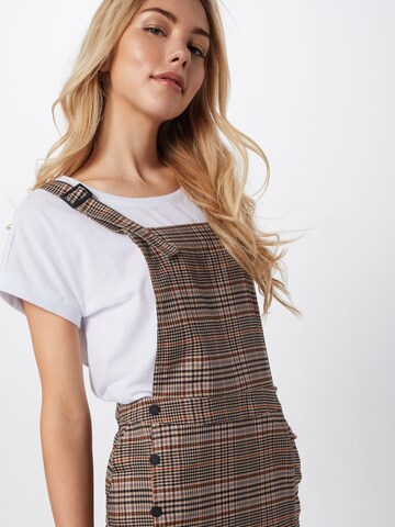 Review Overgooier 'CHECK DUNGAREEDR' in Beige