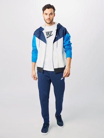 Nike Sportswear Zúžený Kalhoty 'Club Fleece' – modrá
