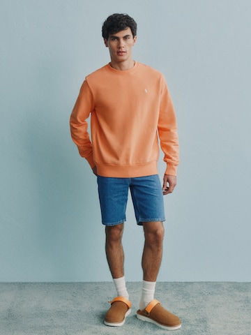 Orange Sweater With Denim Shorts Look