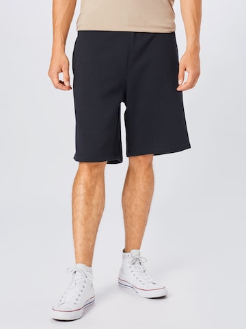 CONVERSE Regular Trousers in Black: front