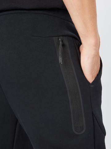 Effilé Pantalon Nike Sportswear en noir