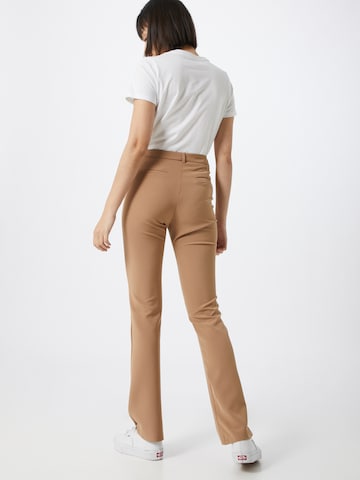 Flared Pantaloni 'sassy' di Moves in beige