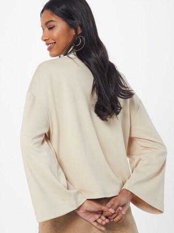 ABOUT YOU Sweatshirt 'Genia' i beige: bakside