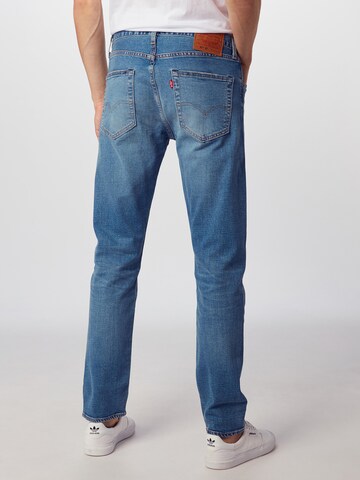 LEVI'S ® Avsmalnet Jeans '501' i blå: bakside