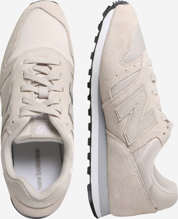 Baskets basses 'WL373' new balance en beige : sur le côté