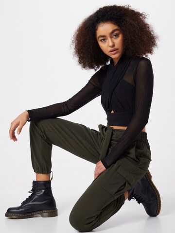 Tapered Pantaloni cu buzunare 'Poptrash' de la ONLY pe verde