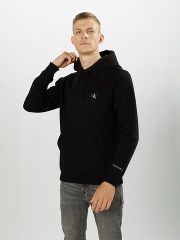 Coupe regular Sweat-shirt Calvin Klein Jeans en noir : devant