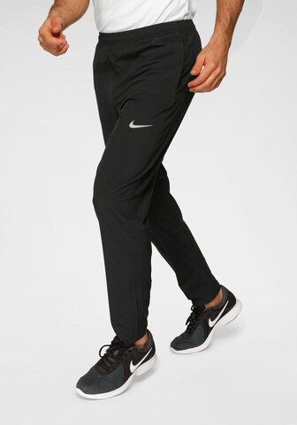 NIKE Regular Laufhose 'RUN STRIPE' in Schwarz