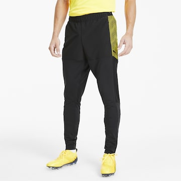 Effilé Pantalon de sport PUMA en noir : devant