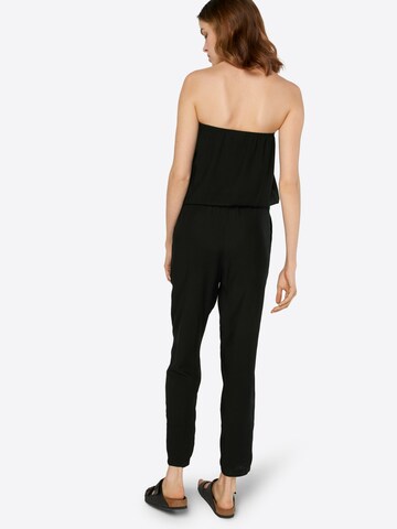 Salopeta de la Urban Classics pe negru: spate