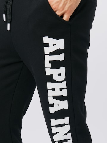 Effilé Pantalon ALPHA INDUSTRIES en noir