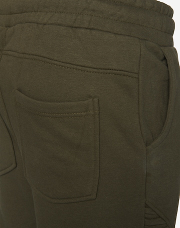 Slimfit Pantaloni di Urban Classics in verde