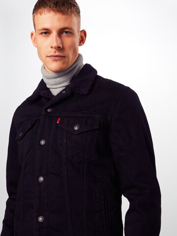 LEVI'S ® Between-season jacket 'Type 3 Sherpa Trucker' in Black