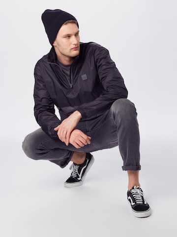 Urban Classics Regular fit Φθινοπωρινό και ανοιξιάτικο μπουφάν σε μαύρο