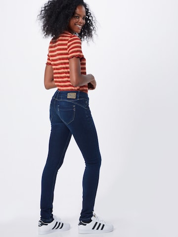 Skinny Jean 'Nena' Gang en bleu : derrière