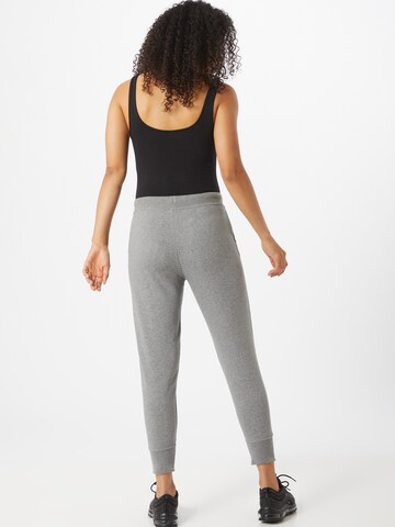 NIKE Tapered Sports trousers in Grey