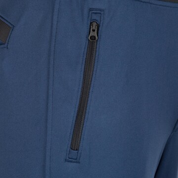 UNDER ARMOUR Tapered Sportbroek in Blauw