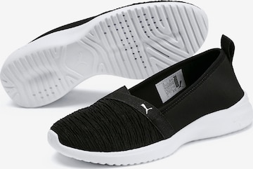 PUMA Slip On in Schwarz