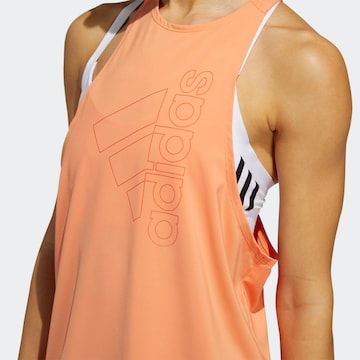 Top sportivo di ADIDAS SPORTSWEAR in arancione