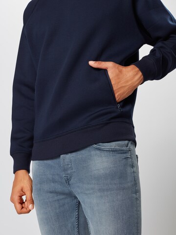 Sweat-shirt Urban Classics en bleu