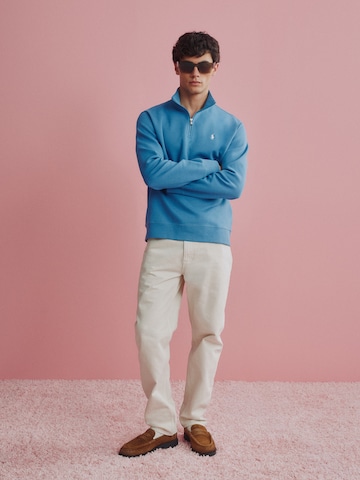 Blue Sweater With Beige Trousers Look