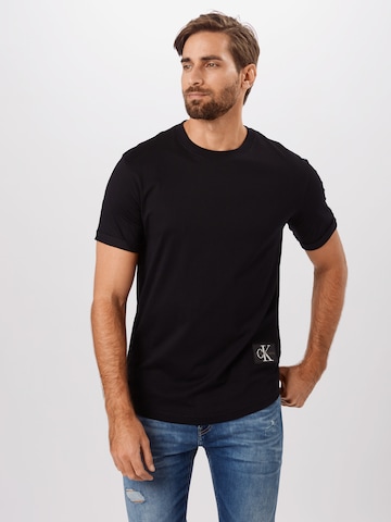 Calvin Klein Jeans T-shirt i svart: framsida