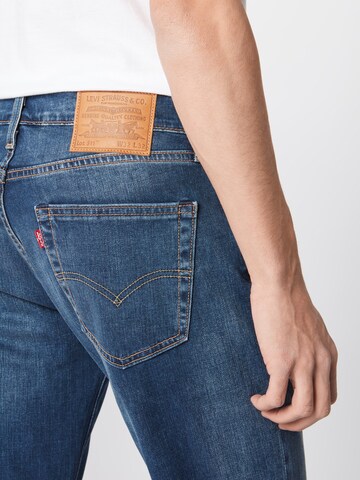 LEVI'S ® Slimfit Jeansy '511' w kolorze niebieski