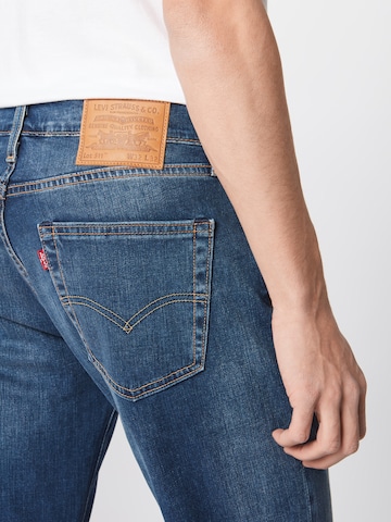 mėlyna LEVI'S ® Prigludęs Džinsai '511'