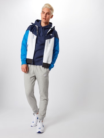 Nike Sportswear Дънки Tapered Leg Панталон в сиво