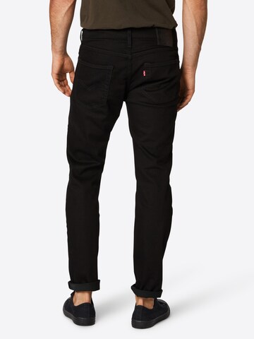 LEVI'S ® Tapered Jeans '502' in Schwarz