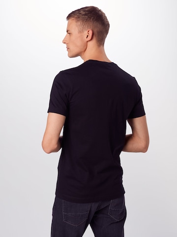 Calvin Klein Jeans Klasický střih Tričko 'Essential' – černá: zadní strana