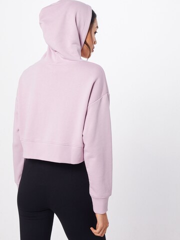 Sweat-shirt 'ATHLETICS' new balance en rose : derrière