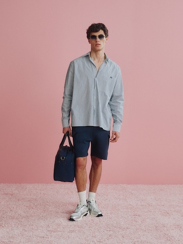 Striped Shirt With Blue Shorts Look