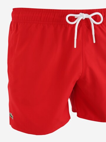 LACOSTE Badeshorts in Rot