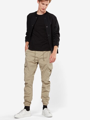 Effilé Pantalon cargo Urban Classics en beige