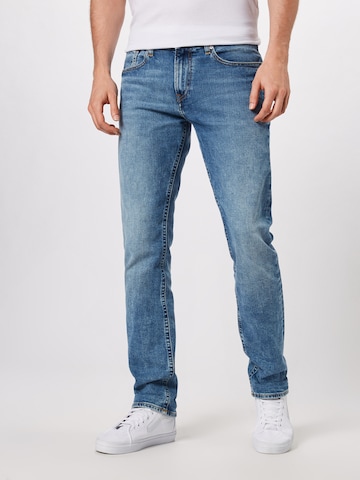 Tommy Jeans Normalny krój Jeansy 'Ryan' w kolorze niebieski