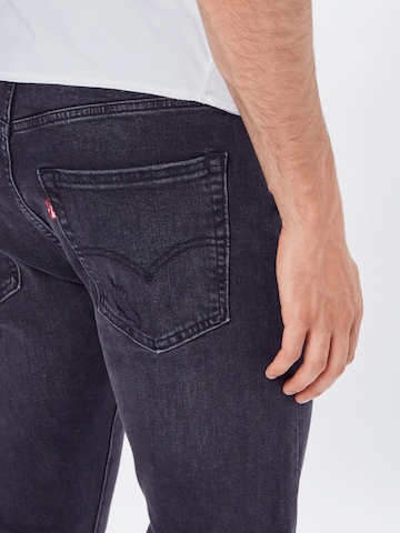 LEVI'S ® Tapered Jeans '512™' in Schwarz