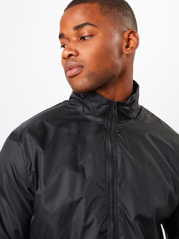 Veste mi-saison Urban Classics en noir