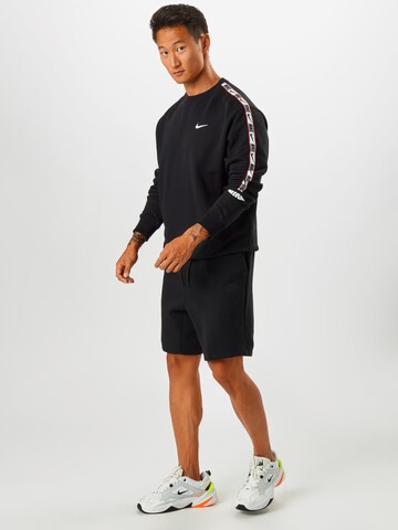 juoda Nike Sportswear Standartinis Kelnės